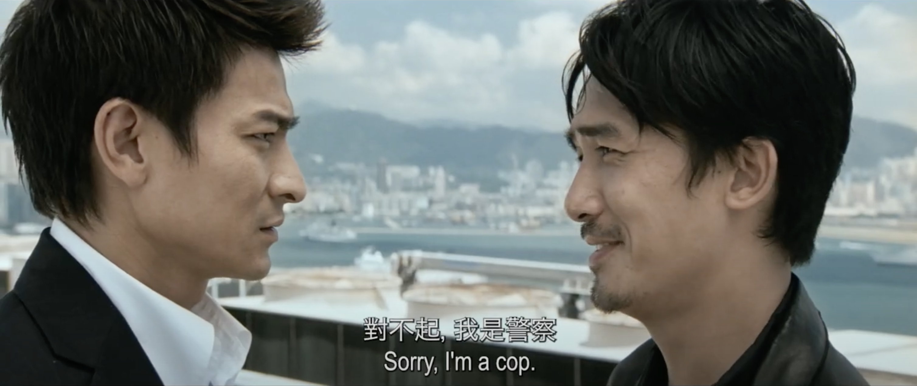 Screenshot from the movie "Infernal Affairs" featuring a tense confrontation between two characters, with Cantonese subtitles. This image serves as a tutorial header for SubEasy's blog on generating Mandarin subtitles for Cantonese videos.